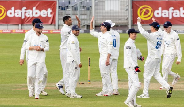 Sussex players celebrate after taking a wicket against Durham