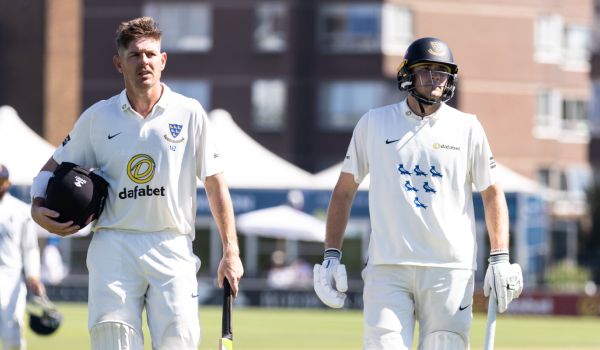 Dan Hughes and James Coles trudge off the field at Tea after a dominant session with the bat.