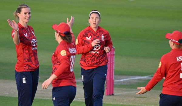 England Women players celebrate after taking a wicket against West Indies Women