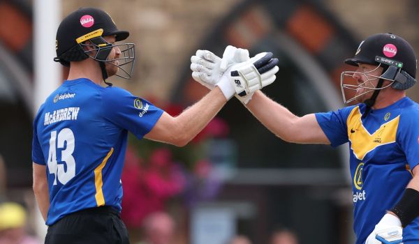 Nathan McAndrew and Danny Lamb shake hands in celebration over the win against Gloucestershire.
