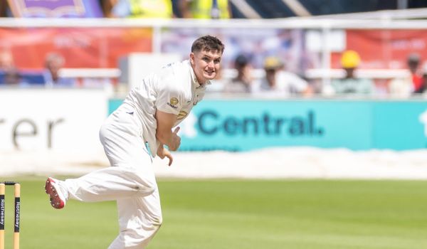 Jack Carson bowls a ball for Sussex.
