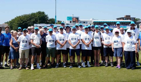 walkers of rons walk on the pitch at hove