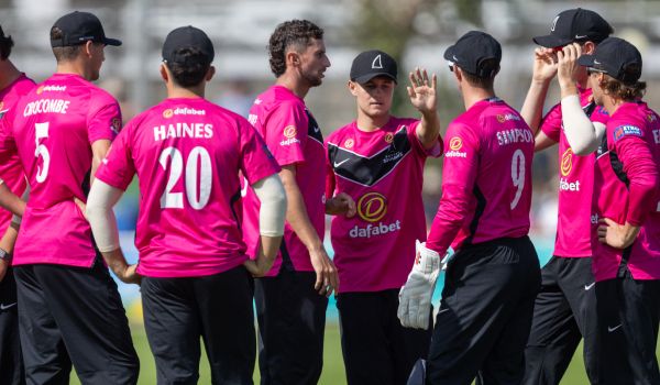 Sussex players celebrate taking a wicket against Yorkshire