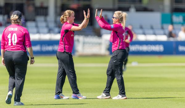 Sussex Women players celebrate after taking a wicket against Middlesex