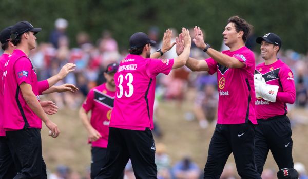 Sussex players celebrate after taking a wicket against Kent