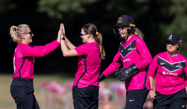 Sussex Sharks players celebrate after taking a wicket at Arundel