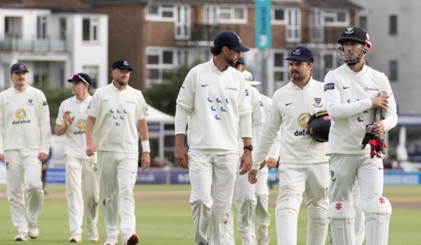Sussex players walk off the field at Hove.