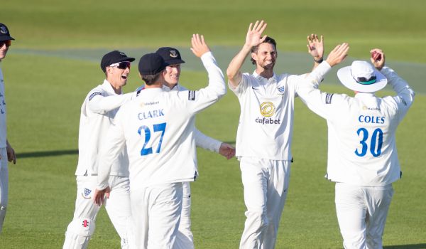 Sussex players celebrate taking a wicket against Somerset in the County Championship