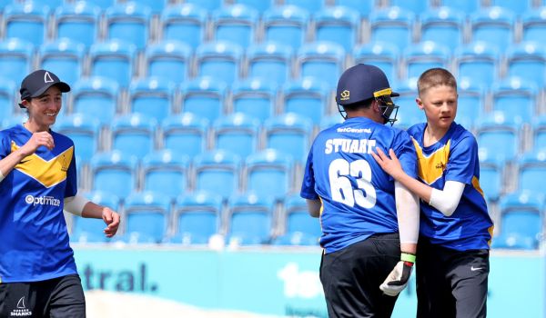 jake vosloo celebrates a wicket with team mates at Hove