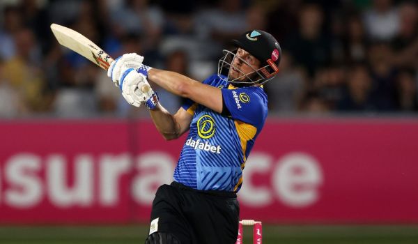 John Simpson batting.