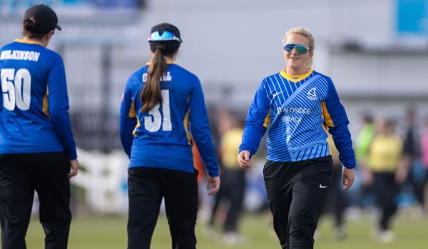 Chiara Green celebrates with her Sussex teammates