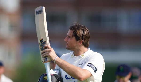 James Coles raises the bat