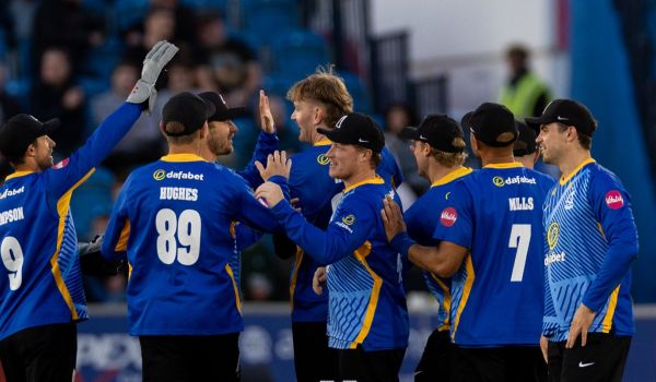 Sharks players celebrate a wicket