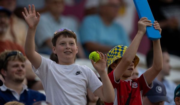 Children in the crowd enjoying a T20 match.