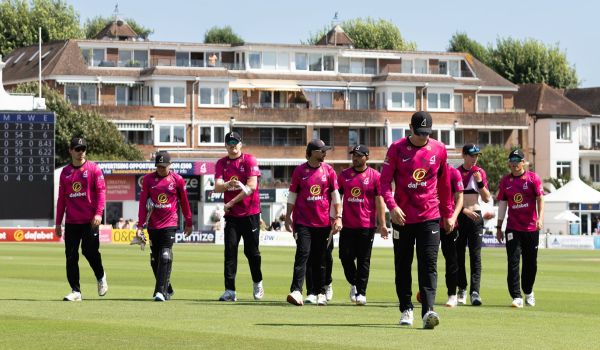 Sussex Sharks players walking off the field after their bowling innings.