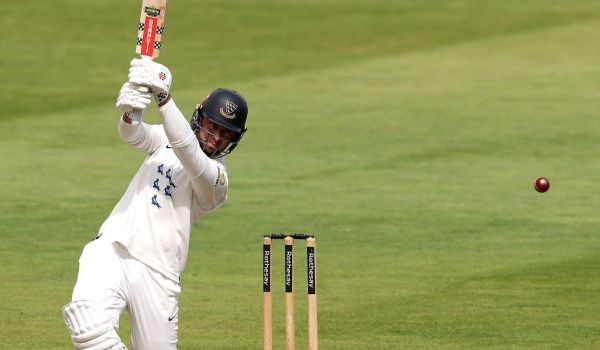 Tom Haines batting.