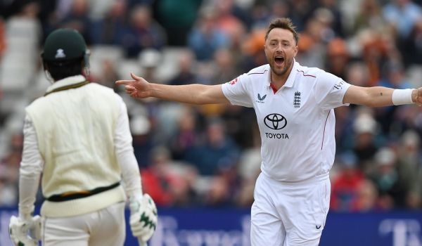 Ollie Robinson celebrates a wicket for England.