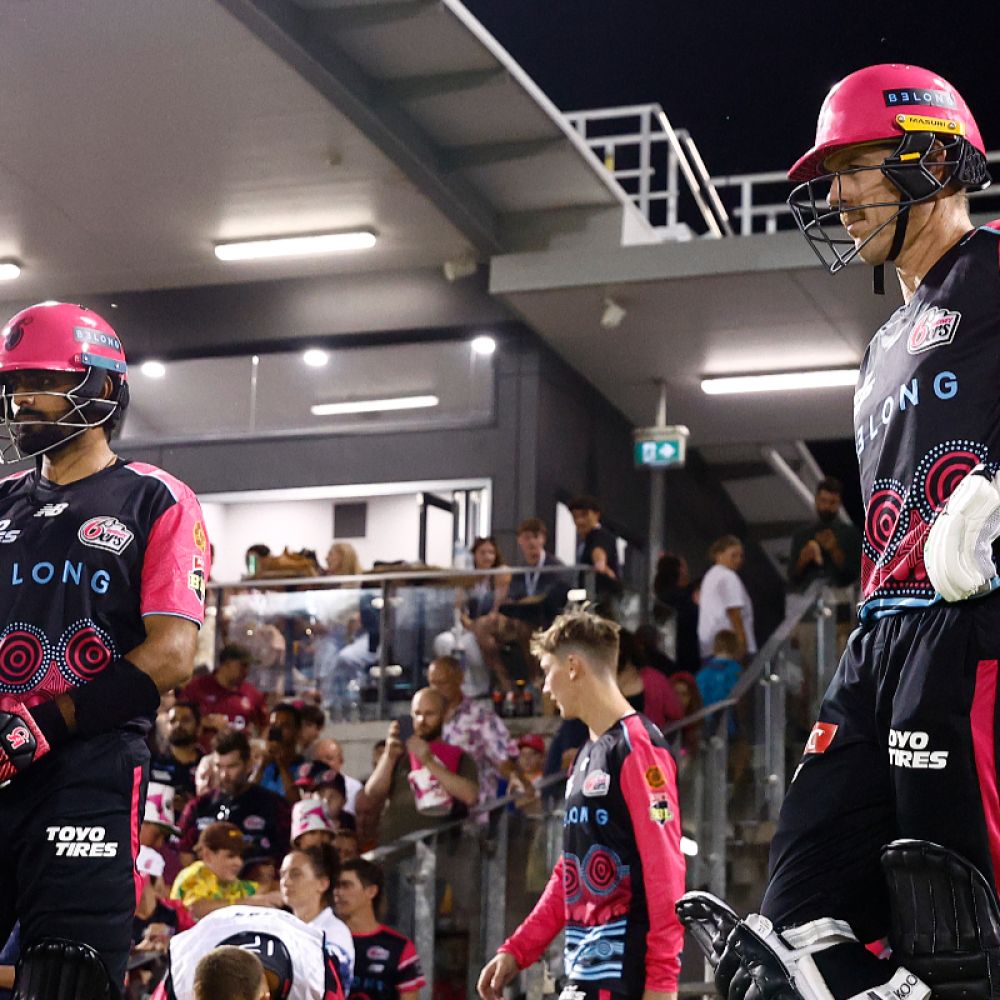 Daniel Hughes and Babar Azam await heading out to the crease